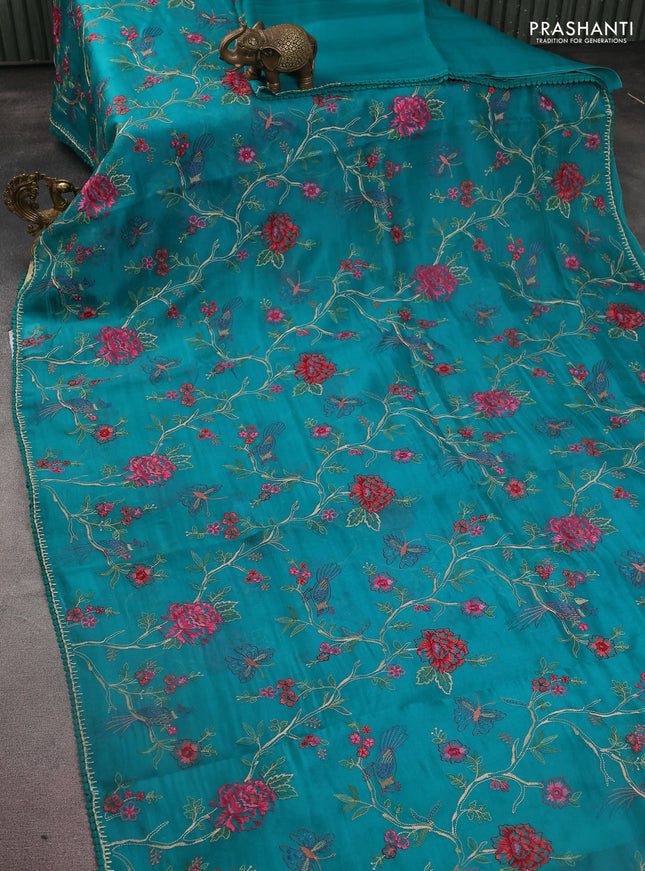 Pure organza silk saree teal green with allover floral embroidery and lace work border