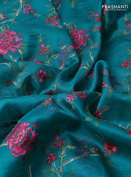 Pure organza silk saree teal green with allover floral embroidery and lace work border