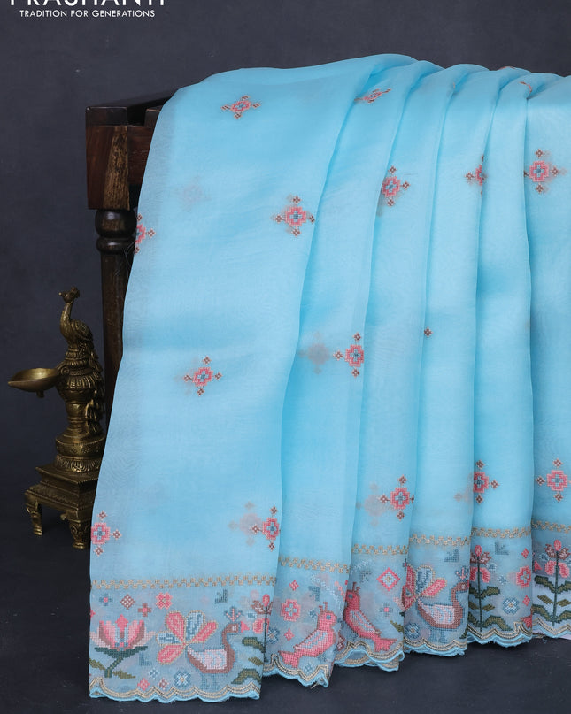 Pure organza silk saree light blue with embroided buttas and embroided border