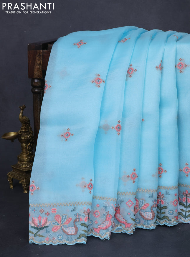 Pure organza silk saree light blue with embroided buttas and embroided border