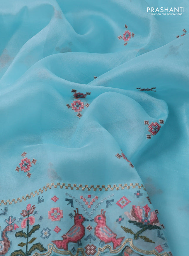 Pure organza silk saree light blue with embroided buttas and embroided border