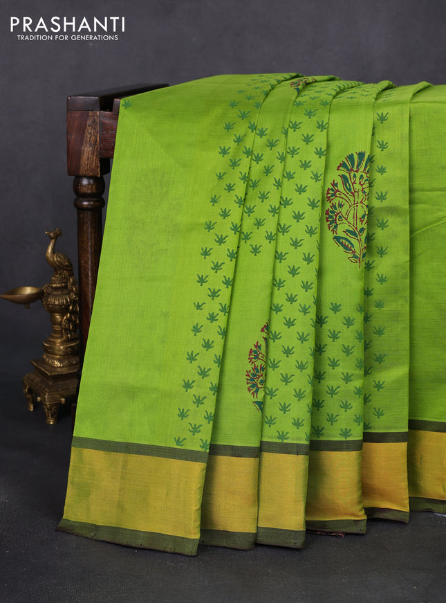 Silk cotton block printed saree light green and deep wine shade with floral butta prints and zari woven border