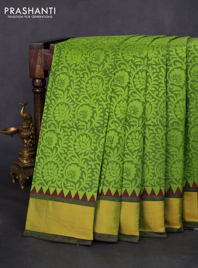 Silk cotton block printed saree light green and wine shade with allover prints and zari woven border