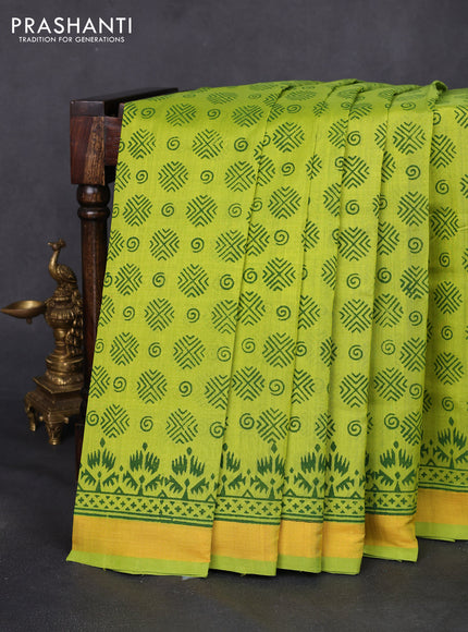 Silk cotton block printed saree fluorescent green with allover butta prints and zari woven border