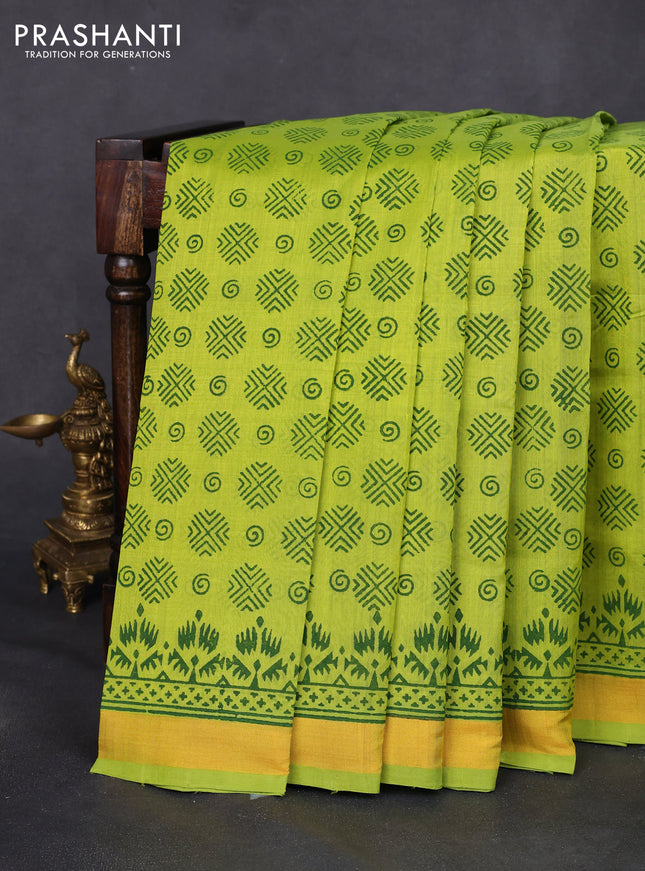 Silk cotton block printed saree fluorescent green with allover butta prints and zari woven border