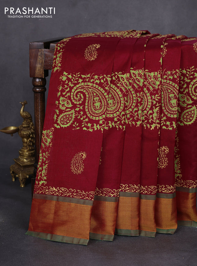 Silk cotton block printed saree maroon and green with allover paisley prints and zari woven border