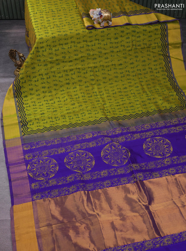 Silk cotton block printed saree dual shade of light green and violet with allover warli prints and zari woven border