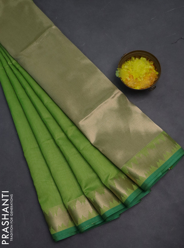 Semi dupion saree light green and teal green with plain body and temple design zari woven border
