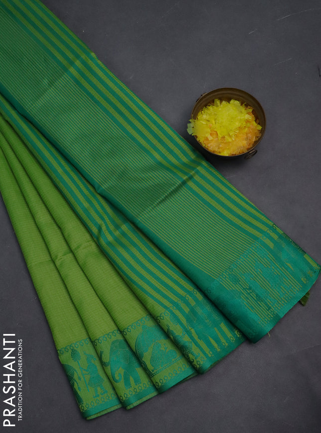 Semi dupion saree light green and green with allover stripe pattern and thread woven border