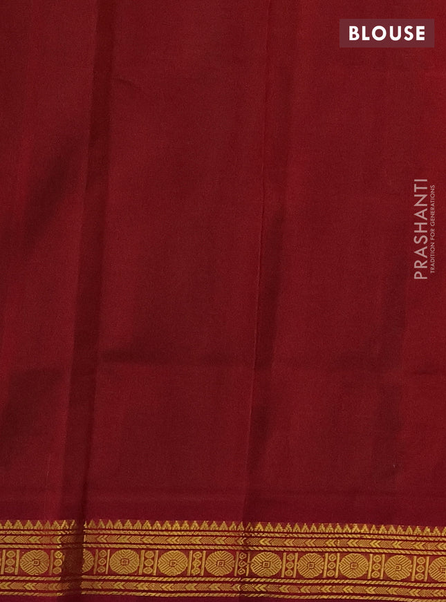 Silk cotton saree green and maroon with plain body and zari woven border