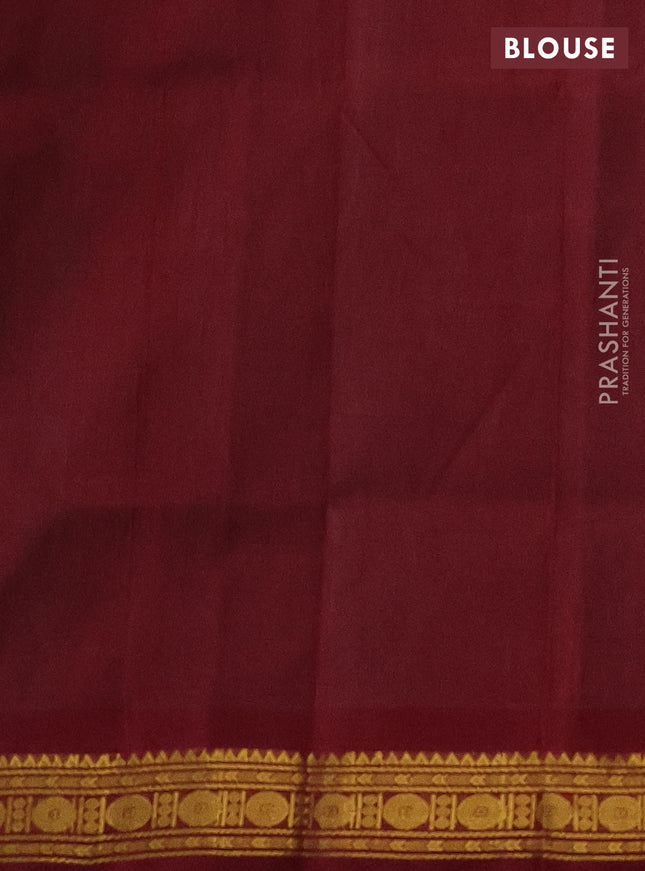 Silk cotton saree teal green and maroon with plain body and zari woven border