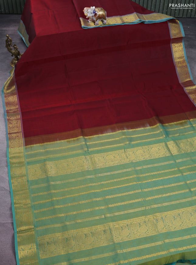 Silk cotton saree maroon and teal green with plain body and zari woven border