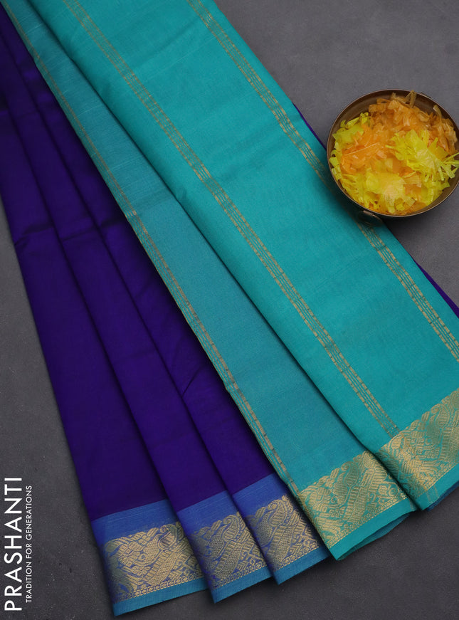 Silk cotton saree dark blue and teal blue with plain body and zari woven border
