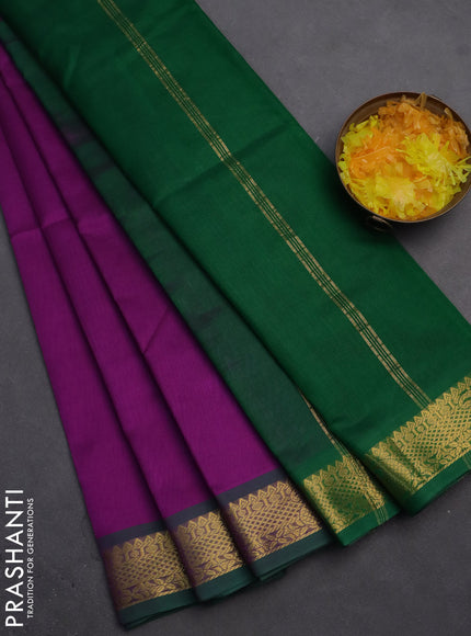 Silk cotton saree purple and green with plain body and zari woven border