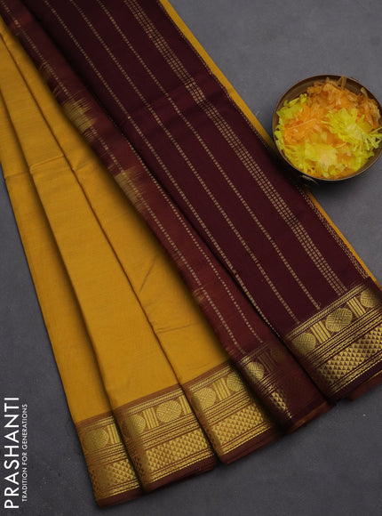 Silk cotton saree mustard yellow and deep maroon with plain body and zari woven border