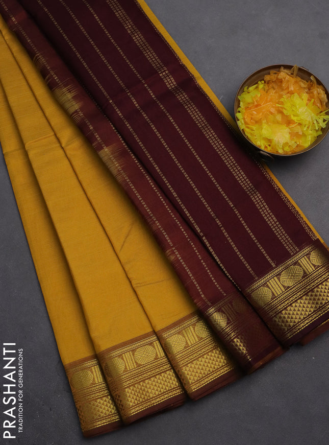 Silk cotton saree mustard yellow and deep maroon with plain body and zari woven border