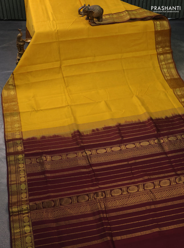 Silk cotton saree mustard yellow and deep maroon with plain body and zari woven border
