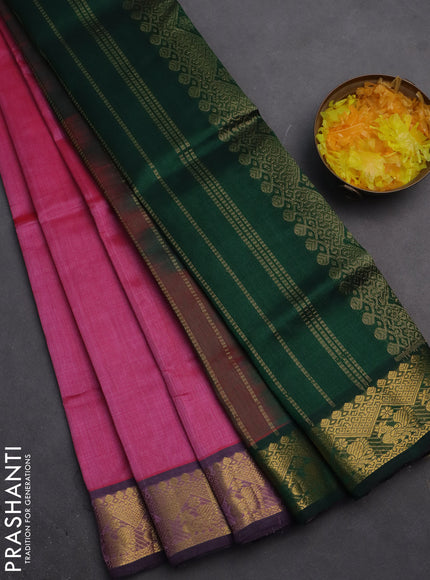 Silk cotton saree pink and dark green with plain body and zari woven border