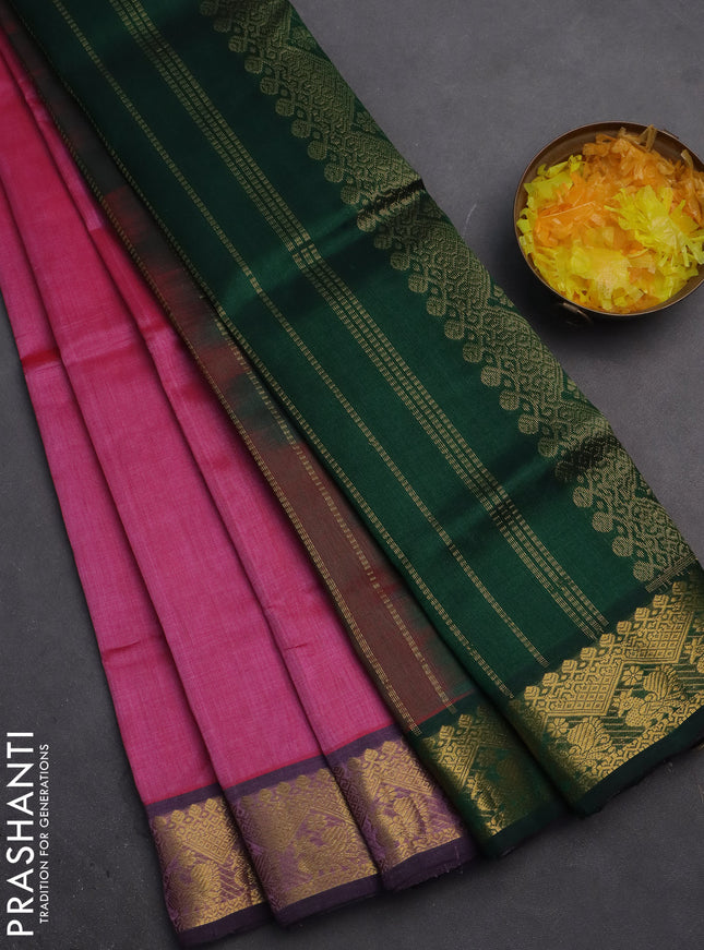 Silk cotton saree pink and dark green with plain body and zari woven border