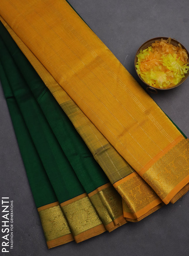 Silk cotton saree green and mustard yellow with plain body and zari woven border