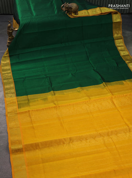 Silk cotton saree green and mustard yellow with plain body and zari woven border