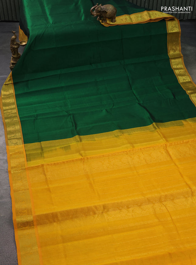 Silk cotton saree green and mustard yellow with plain body and zari woven border