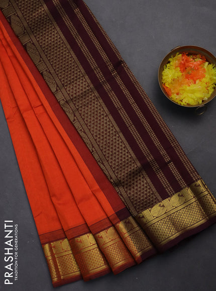 Silk cotton saree orange and deep maroon with plain body and zari woven border