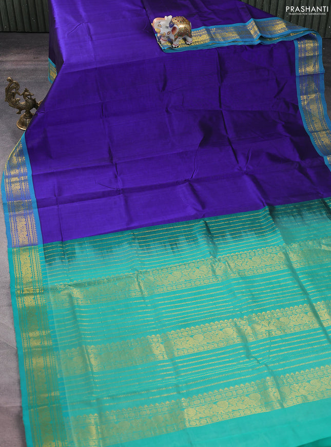 Silk cotton saree blue and teal green with plain body and zari woven border