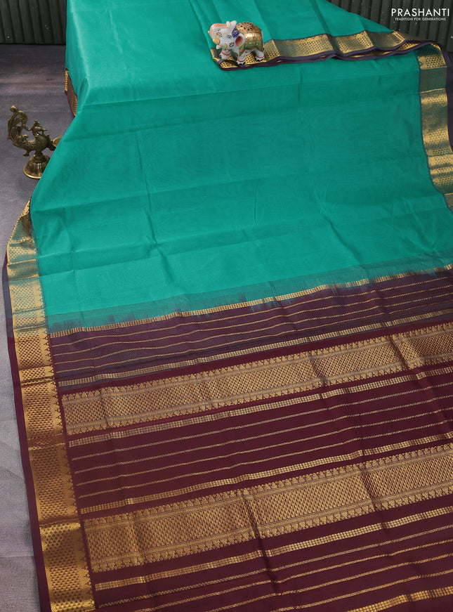 Silk cotton saree teal blue and deep maroon with plain body and zari woven border