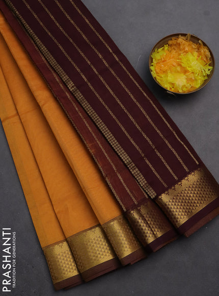 Silk cotton saree mustard yellow and coffee brown with plain body and zari woven border