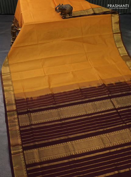 Silk cotton saree mustard yellow and coffee brown with plain body and zari woven border