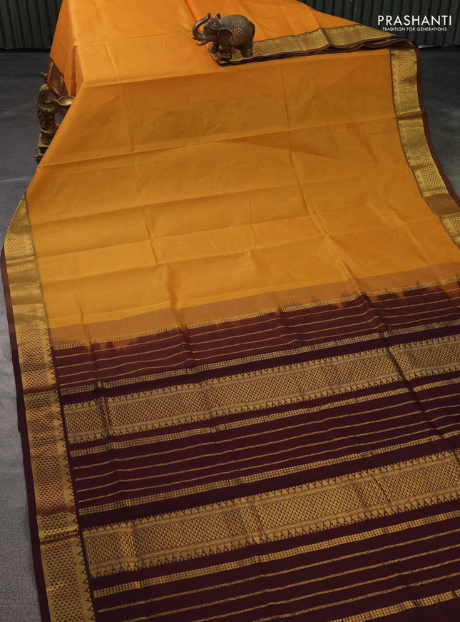 Silk cotton saree mustard yellow and coffee brown with plain body and zari woven border