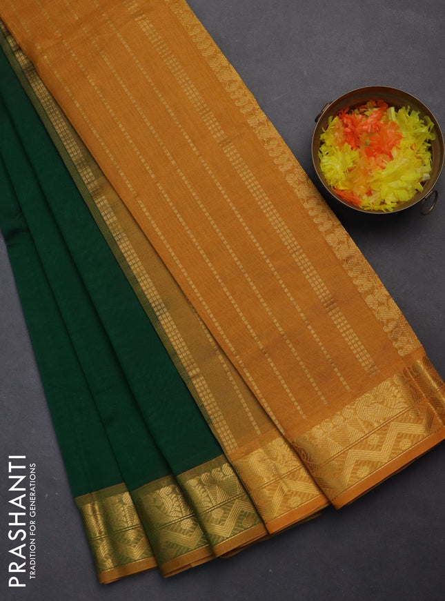 Silk cotton saree green and mustard yellow with plain body and zari woven border