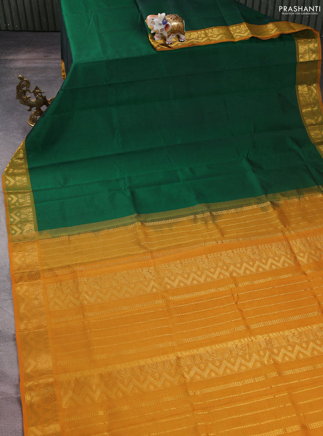Silk cotton saree green and mustard yellow with plain body and zari woven border