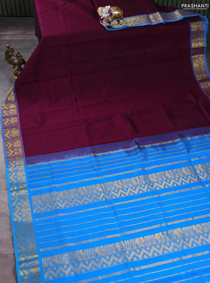 Silk cotton saree wine shade and cs blue with plain body and zari woven border
