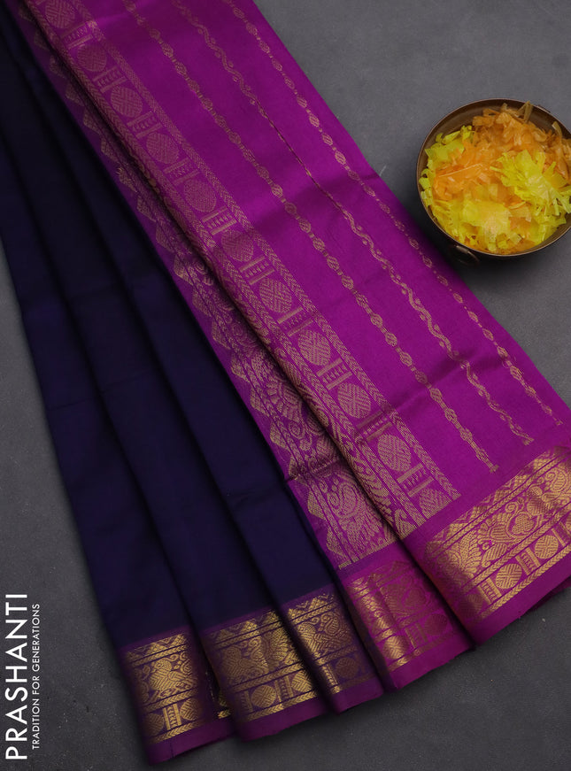 Silk cotton saree navy blue and purple with plain body and zari woven border