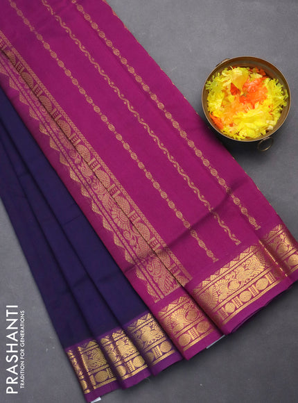 Silk cotton saree navy blue and purple with plain body and zari woven border