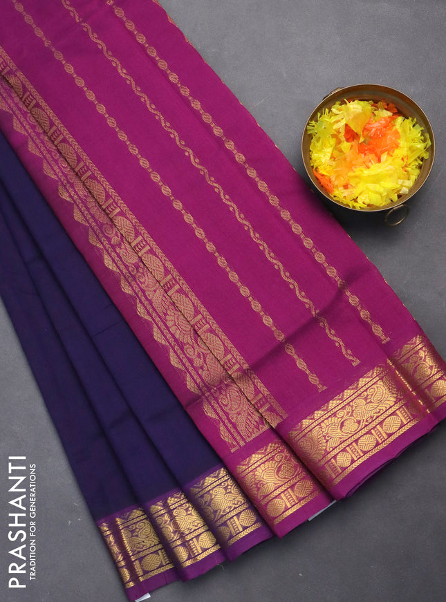 Silk cotton saree navy blue and purple with plain body and zari woven border