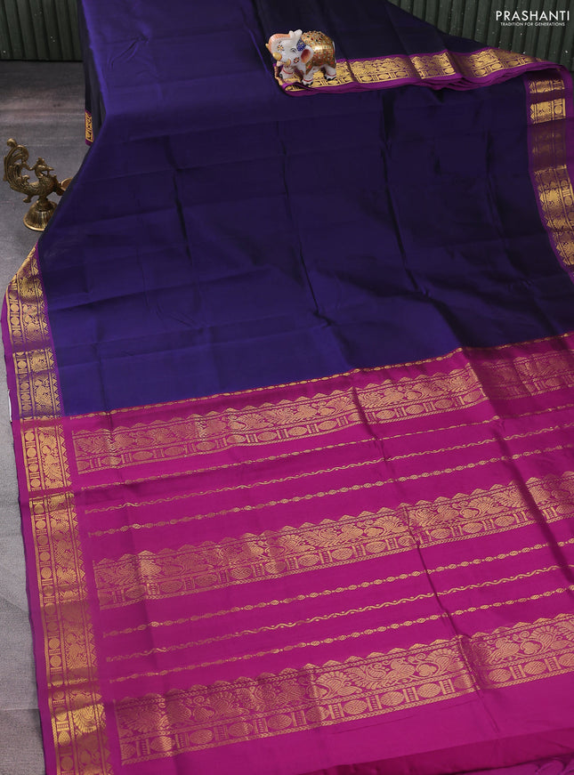 Silk cotton saree navy blue and purple with plain body and zari woven border
