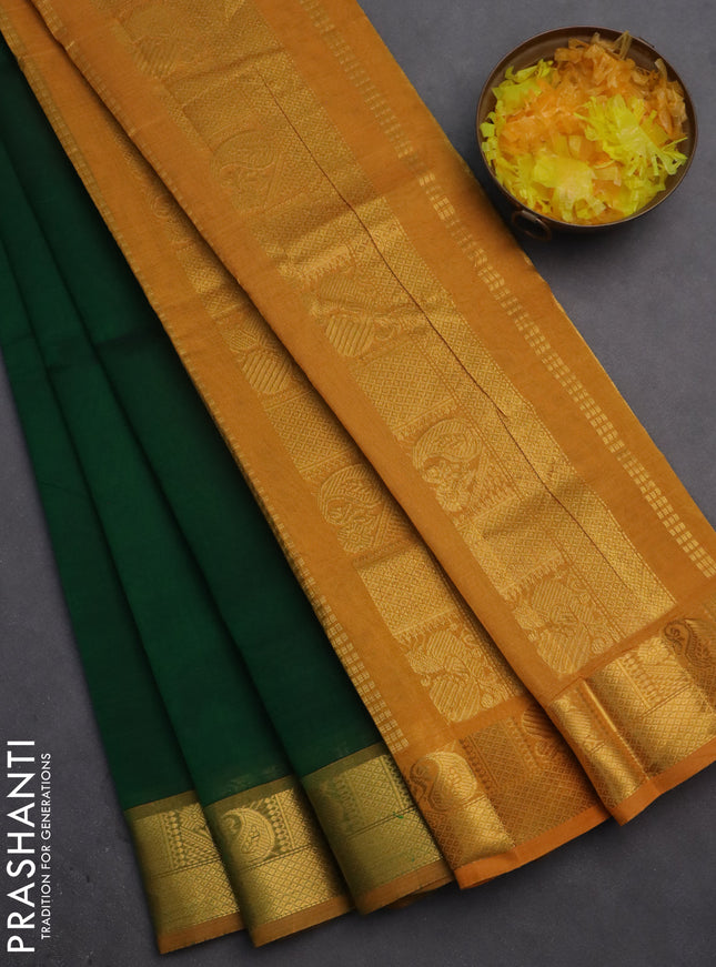 Silk cotton saree green and mustard yellow with plain body and zari woven border