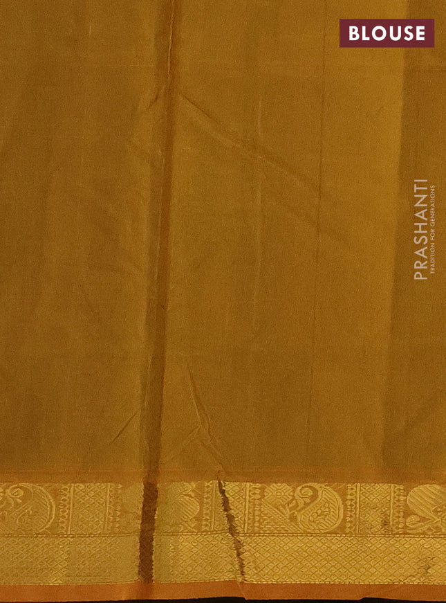 Silk cotton saree green and mustard yellow with plain body and zari woven border