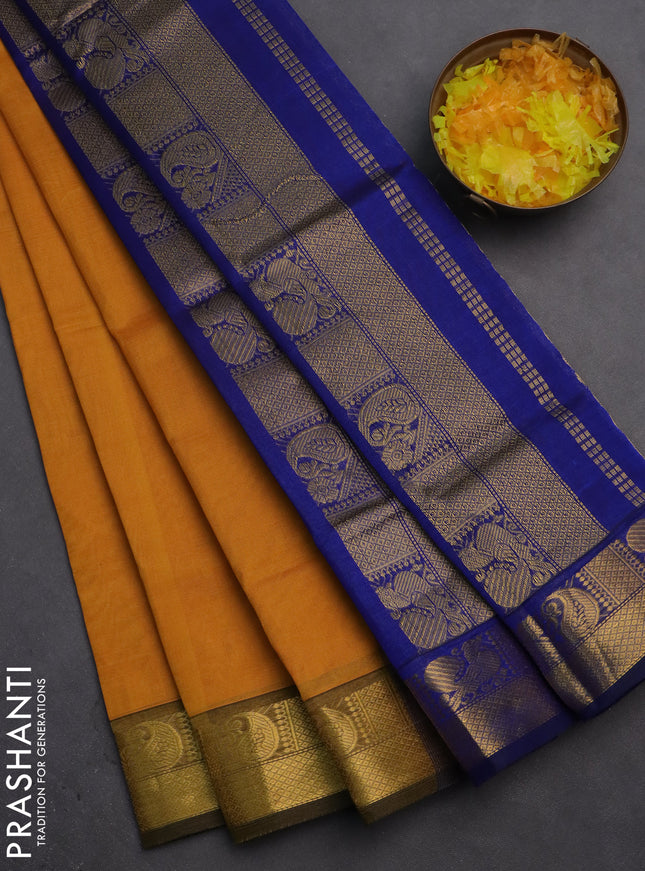 Silk cotton saree mustard yellow and blue with plain body and zari woven border