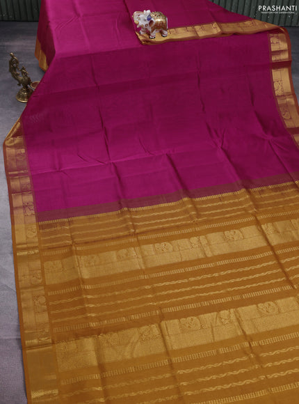 Silk cotton saree magenta pink and mustard yellow with plain body and zari woven border