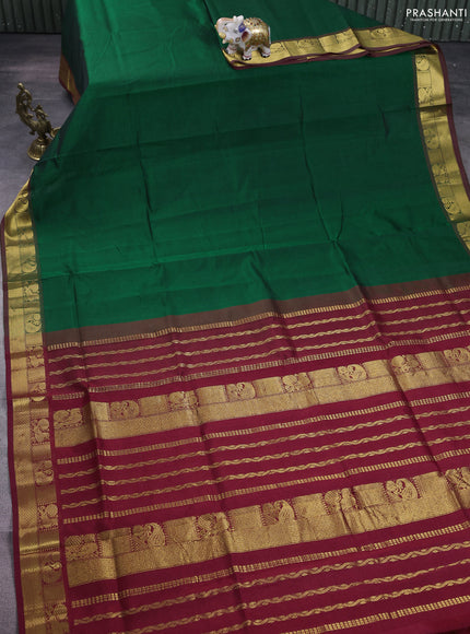 Silk cotton saree green and maroon with plain body and zari woven border