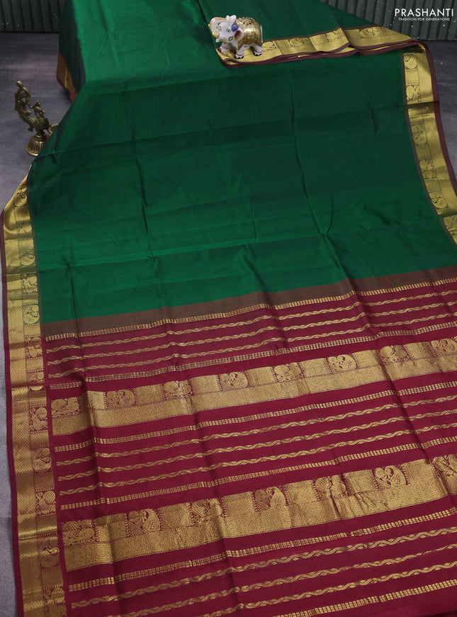 Silk cotton saree green and maroon with plain body and zari woven border