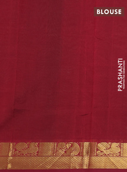 Silk cotton saree green and maroon with plain body and zari woven border