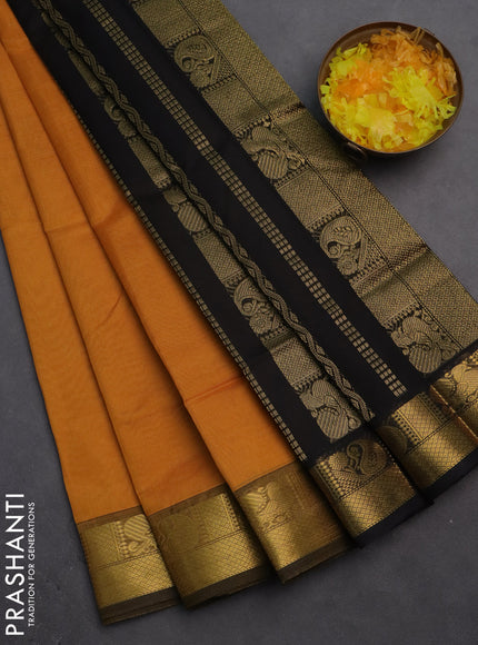 Silk cotton saree mustard yellow and black with plain body and zari woven border