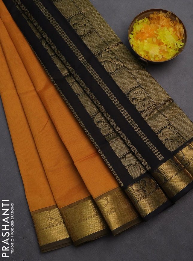Silk cotton saree mustard yellow and black with plain body and zari woven border