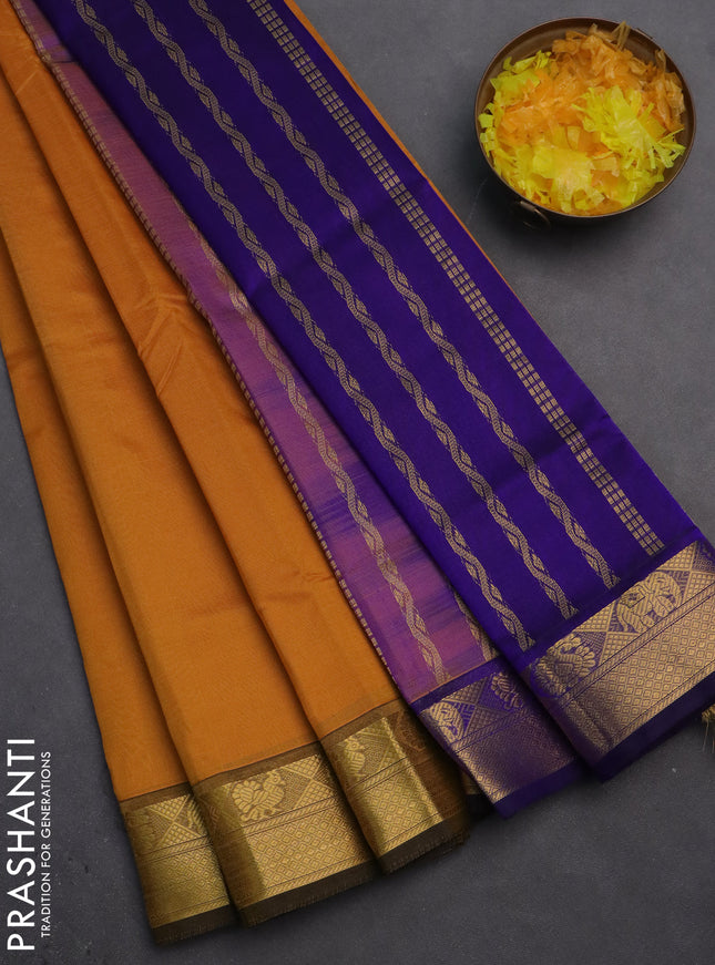 Silk cotton saree mustard yellow and blue with plain body and zari woven border