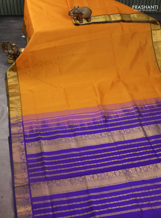 Silk cotton saree mustard yellow and blue with plain body and zari woven border